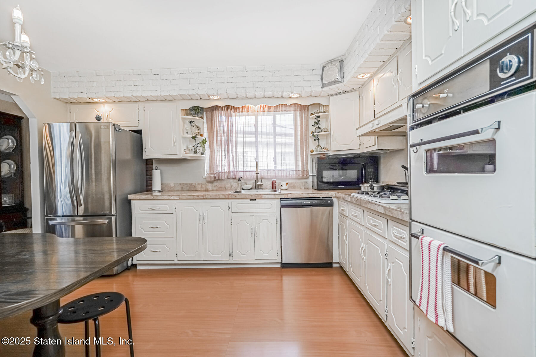 45 Sommer Avenue Staten Island, NY 10314 - Photo 8 of 31 a kitchen with granite countertop a refrigerator stove top oven and sink
