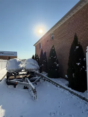 a view of a house with wooden fence