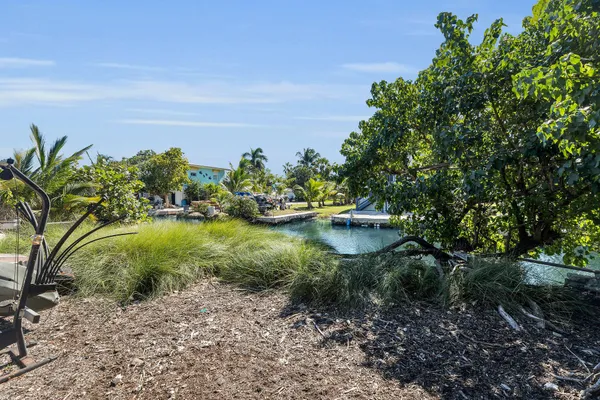 a view of a lake with a garden