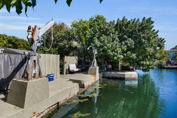 swimming pool view with a seating space