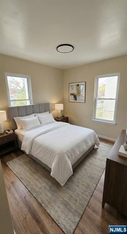 518-520 East 23rd Street, Unit 1R Paterson, NJ 07514 - Photo 4 of 4 a bedroom with a bed and a window