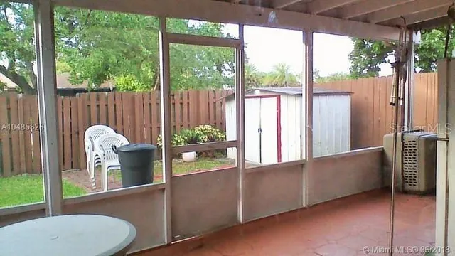 a view of a balcony with chair