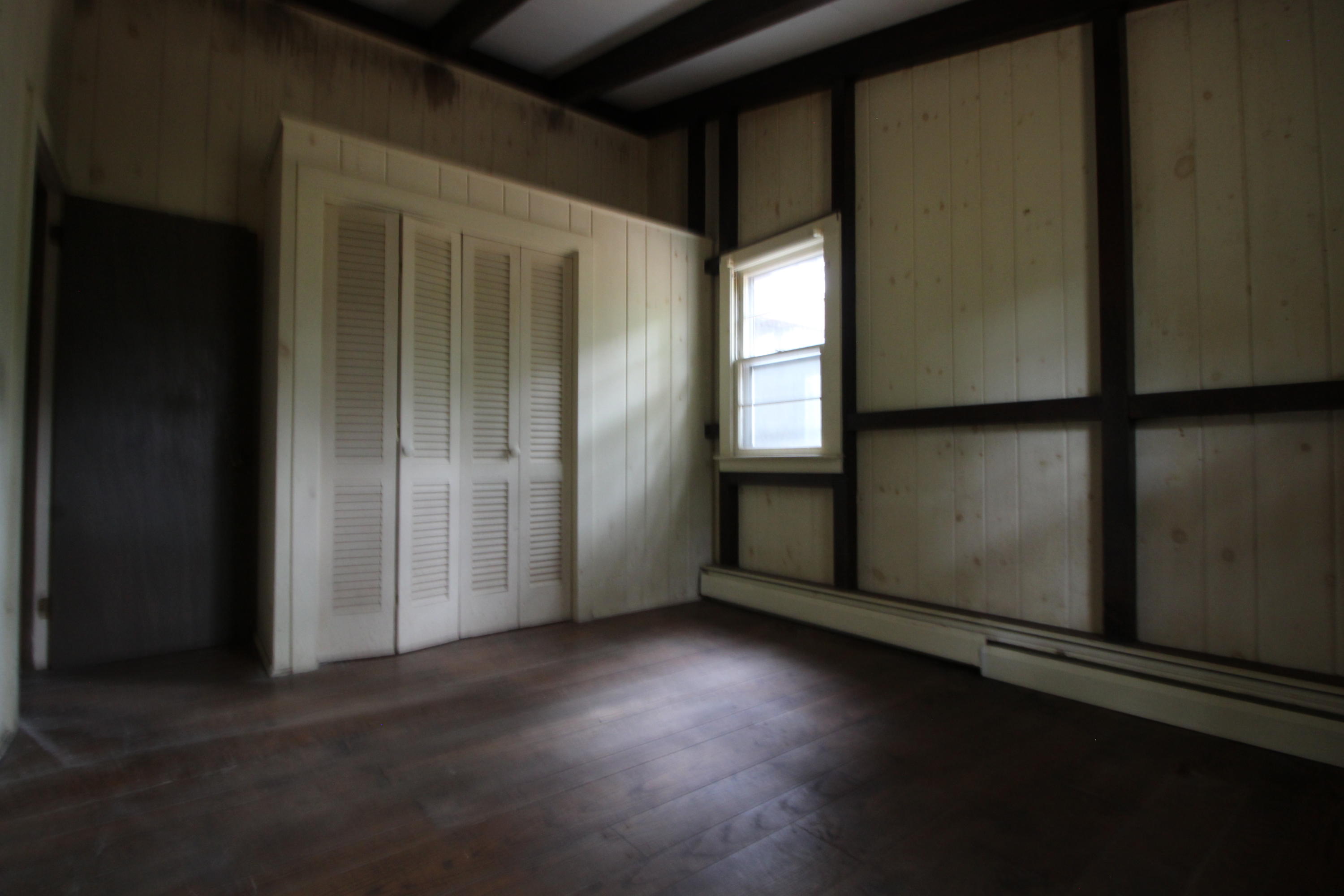 665 Governor Prence Road Eastham, MA 02642 - Photo 13 of 17 an empty room with wooden floor and windows