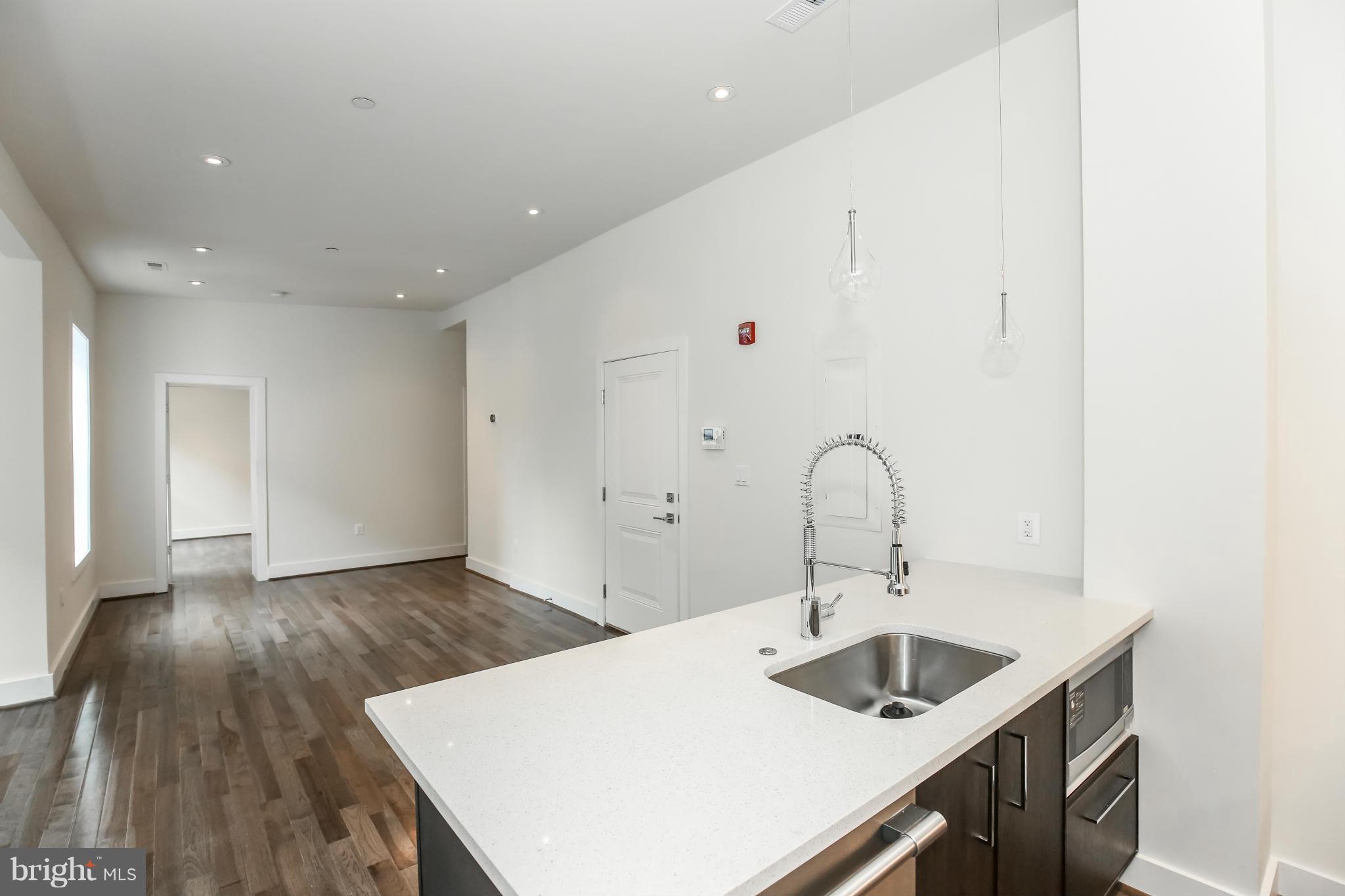 462 Ridge Street Northwest, Unit 3 Washington, DC 20001 - Photo 7 of 20 a kitchen with a sink and cabinets
