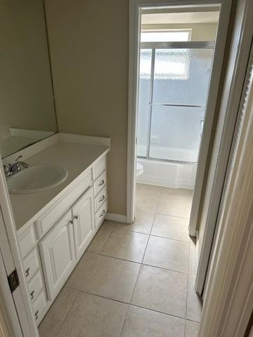 a bathroom with a vanity and a sink