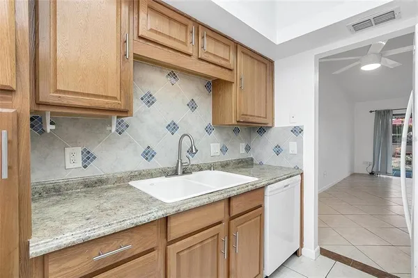 a kitchen with a sink and cabinets
