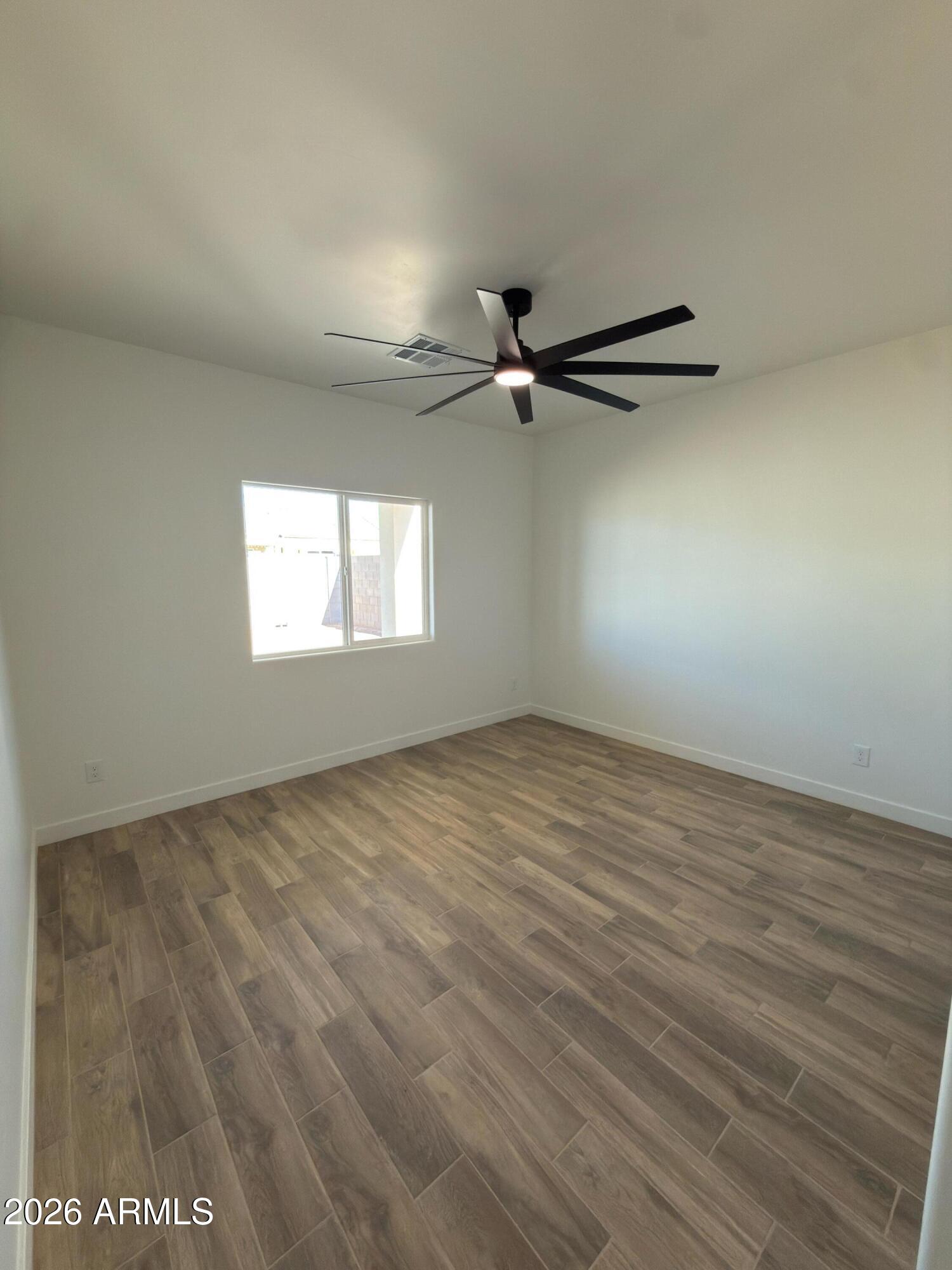 14199 South Diablo Road Arizona City, AZ 85123 - Photo 8 of 18 a view of an empty room with a window