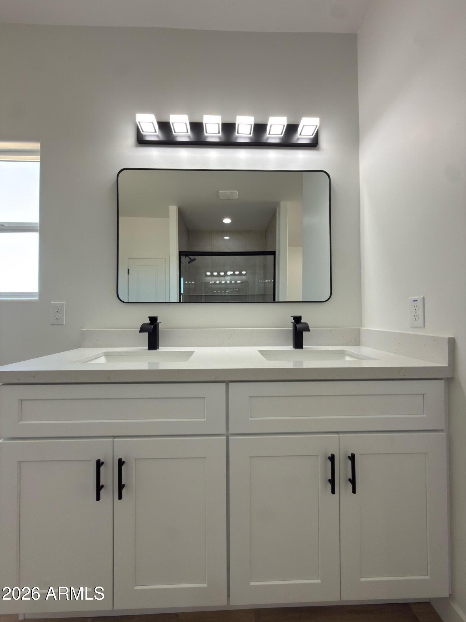 14199 South Diablo Road Arizona City, AZ 85123 - Photo 9 of 18 a bathroom with a sink and a mirror