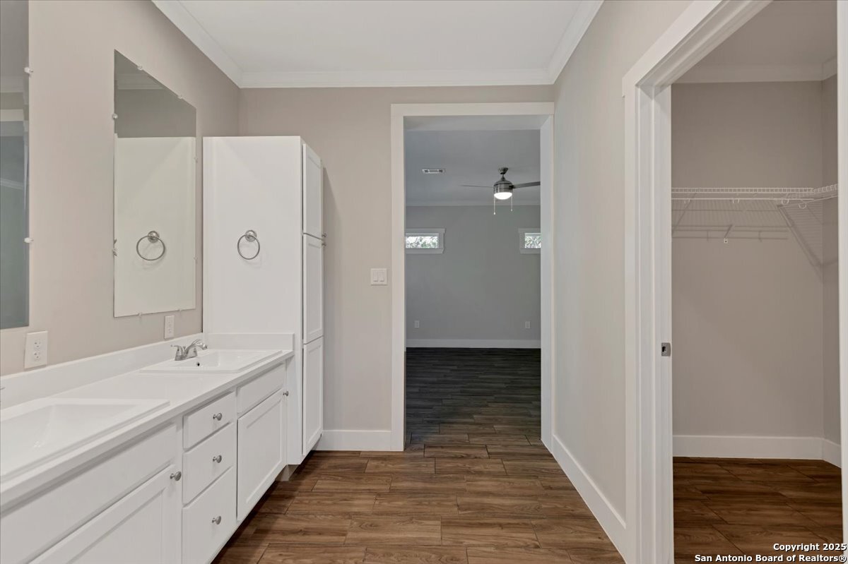 611 Rudolph San Antonio, TX 78202 - Photo 15 of 25 a spacious bathroom with a double vanity sink a mirror and a shower