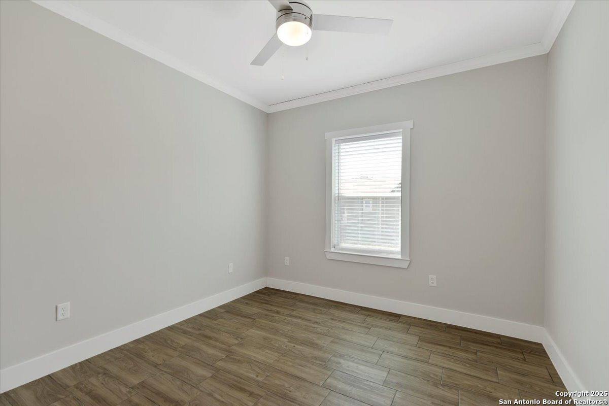 611 Rudolph San Antonio, TX 78202 - Photo 20 of 25 an empty room with wooden floor and windows