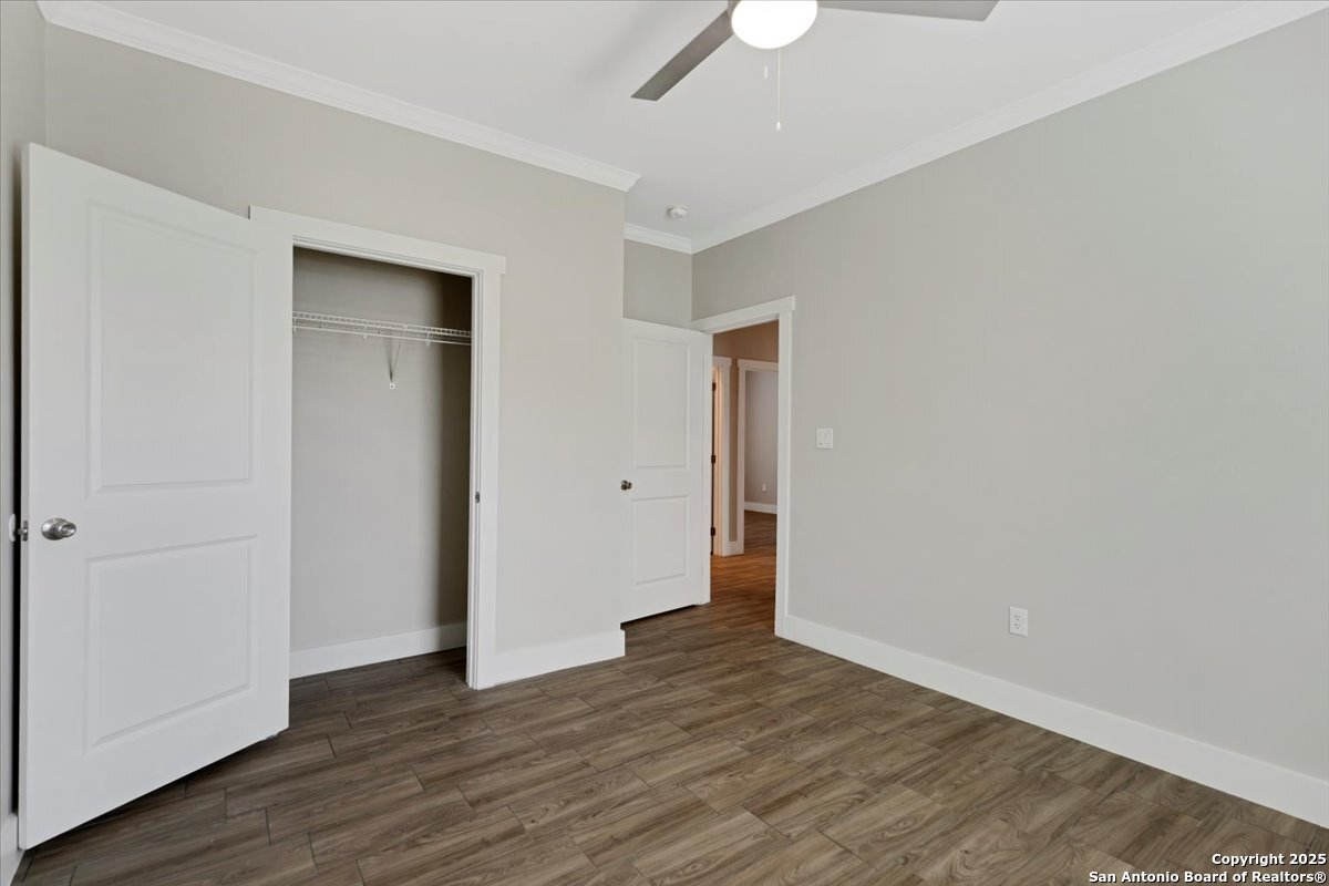 611 Rudolph San Antonio, TX 78202 - Photo 21 of 25 a view of an empty room with wooden floor & closet