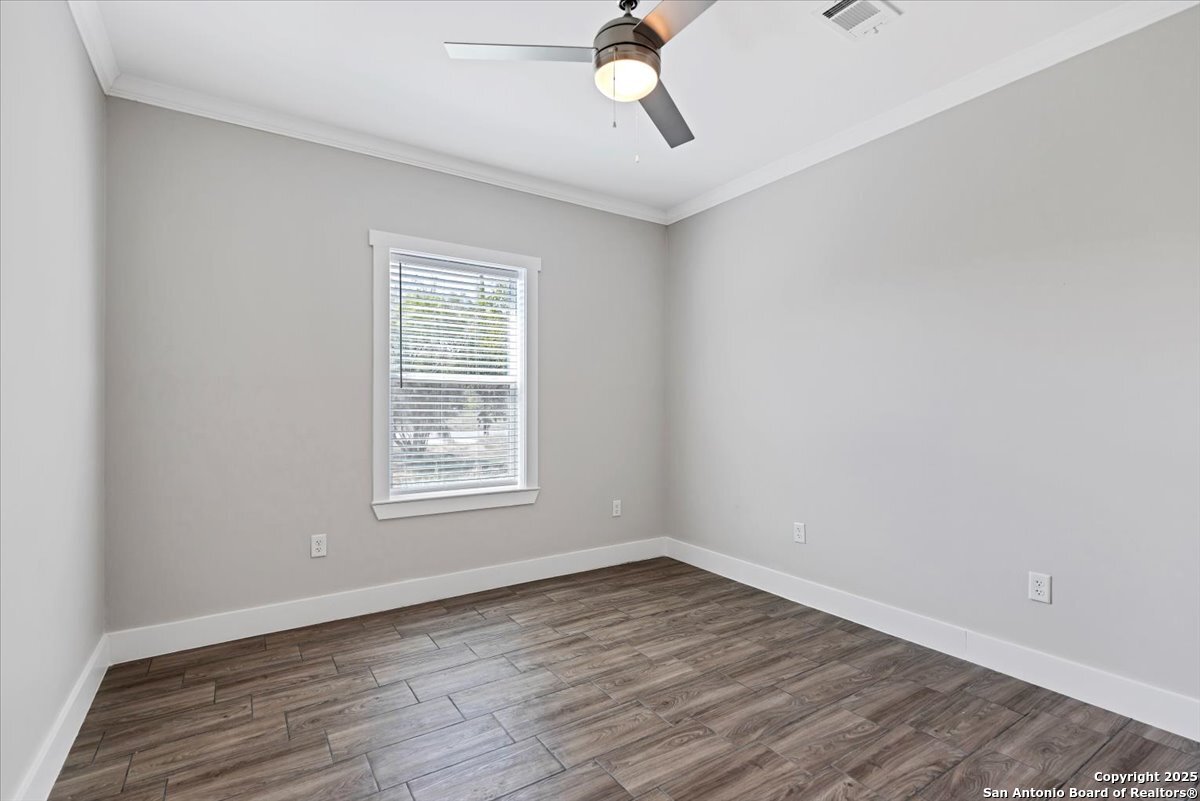 611 Rudolph San Antonio, TX 78202 - Photo 22 of 25 a view of an empty room with wooden floor and a window