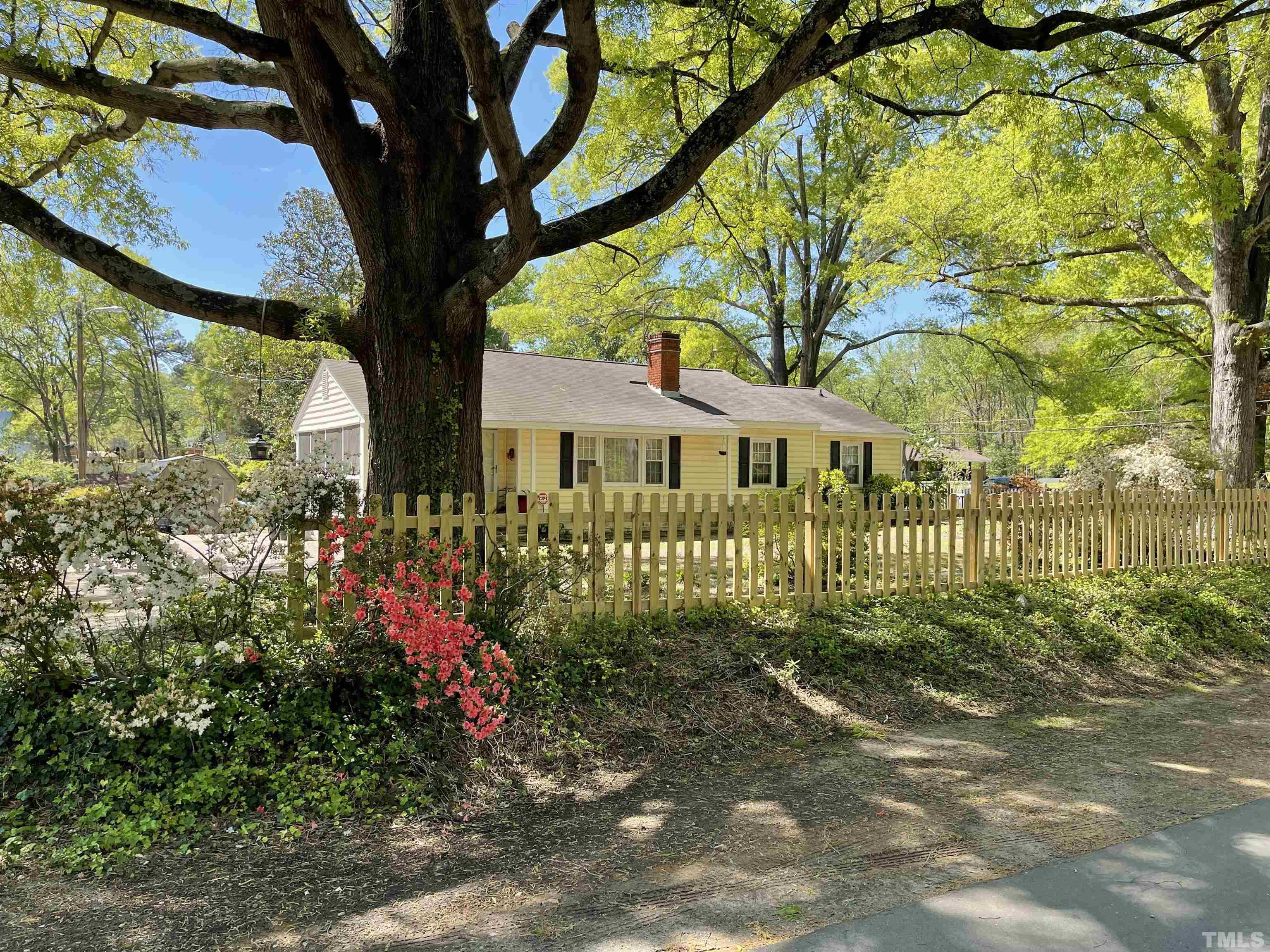 5100 Clearview Street Raleigh, NC 27603 - Photo 1 of 36 a front view of a house having yard