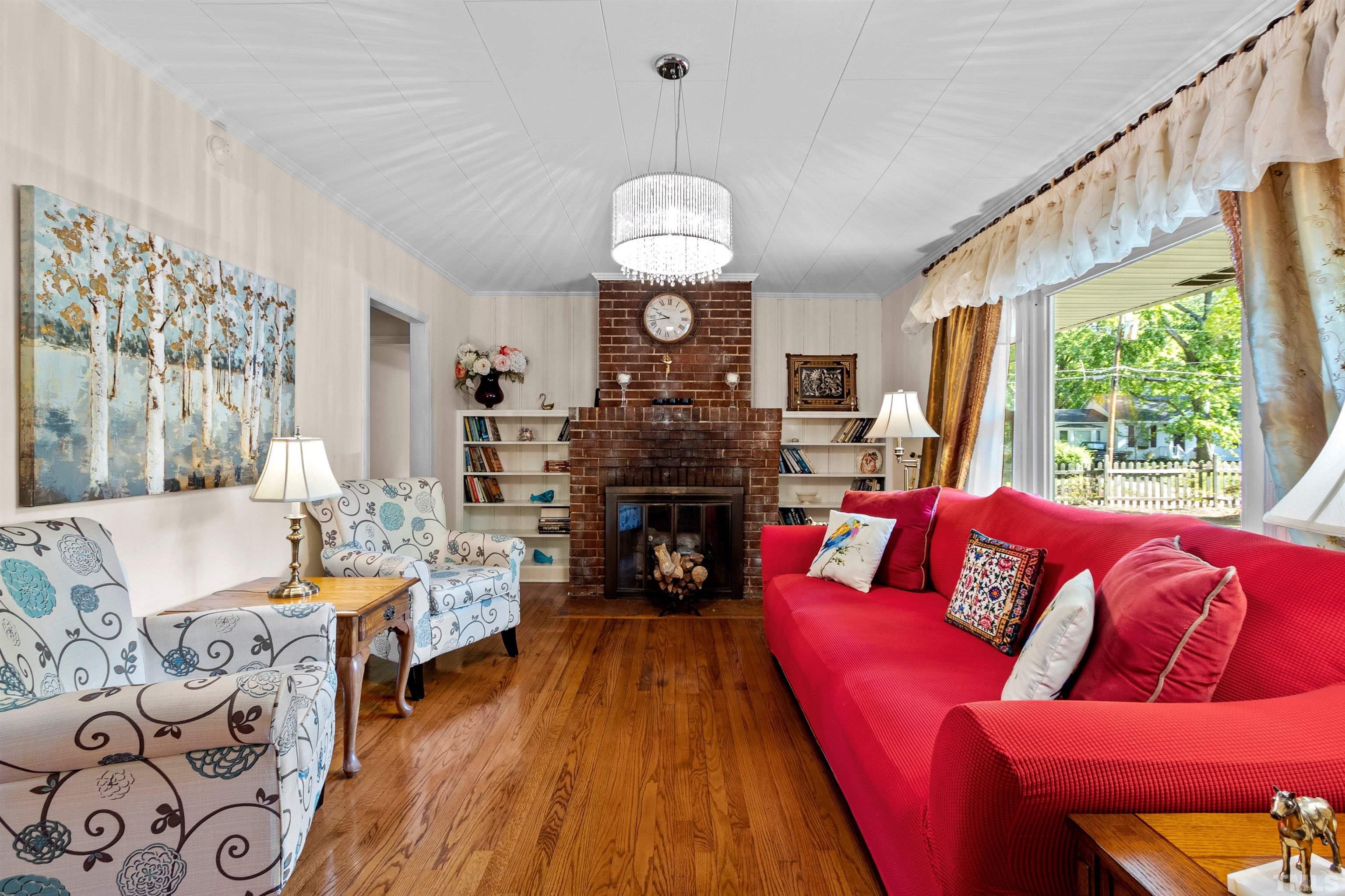 5100 Clearview Street Raleigh, NC 27603 - Photo 29 of 36 a living room with fireplace furniture and a large window