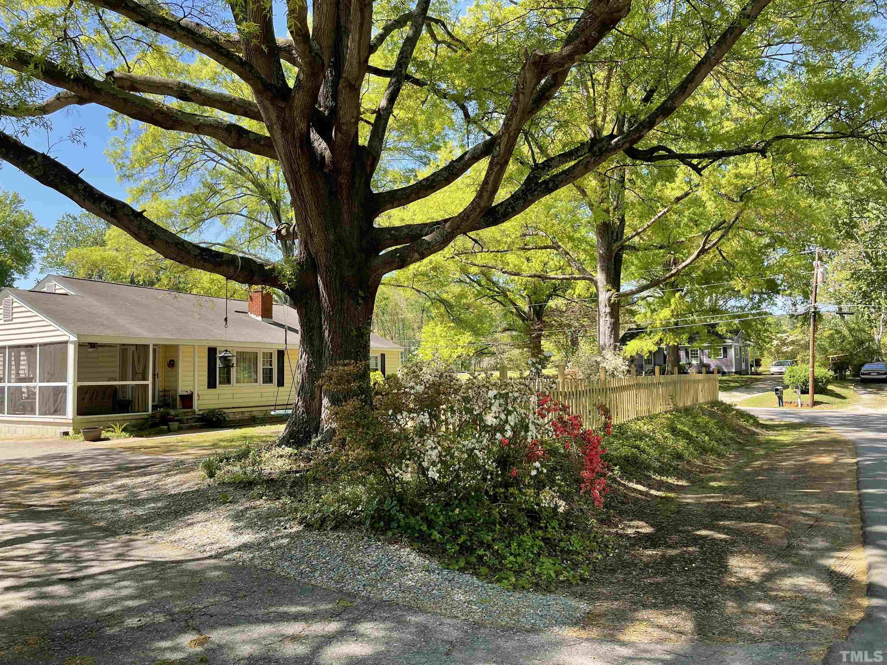 5100 Clearview Street Raleigh, NC 27603 - Photo 3 of 36 a front view of a house with garden
