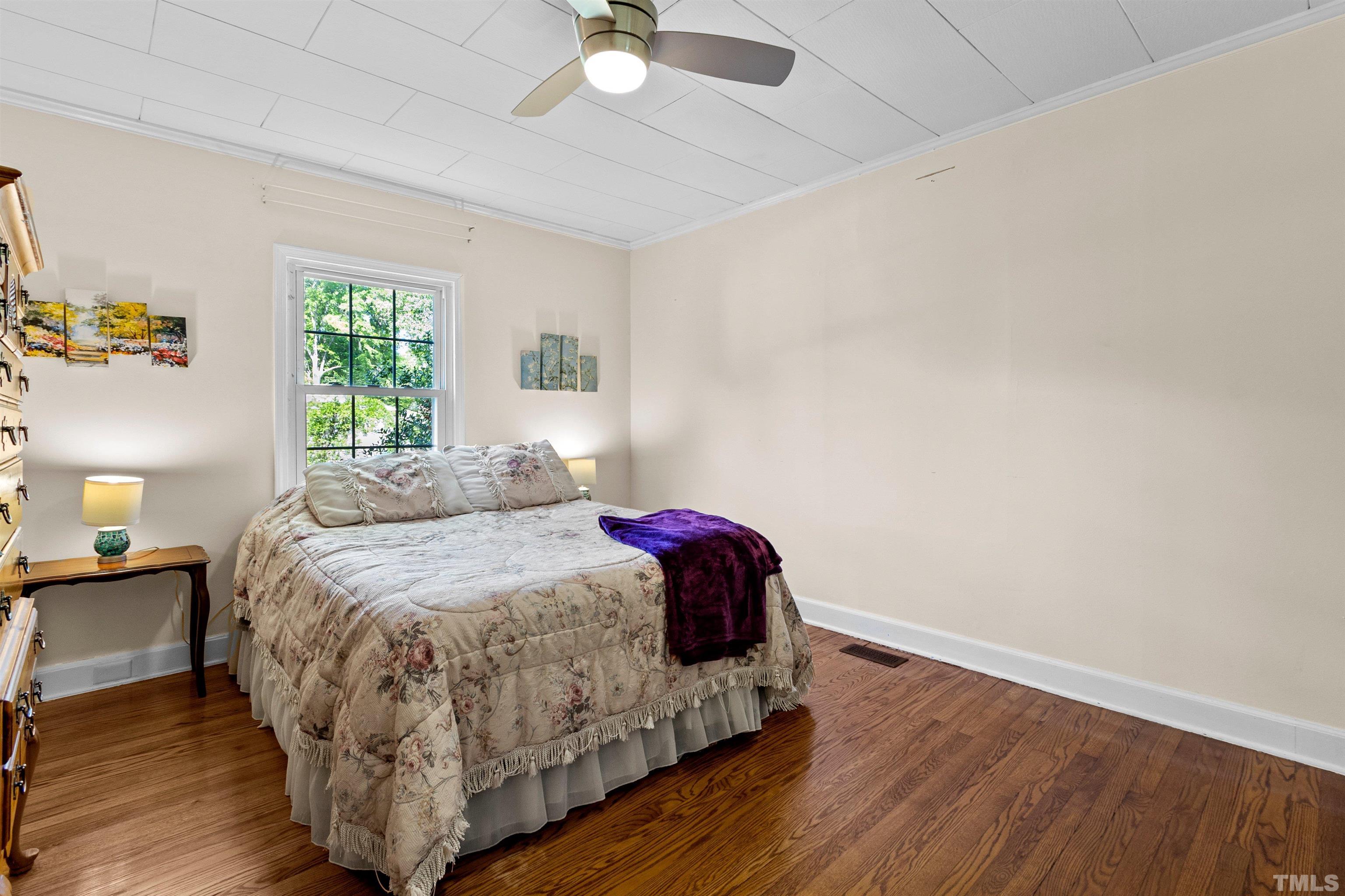 5100 Clearview Street Raleigh, NC 27603 - Photo 33 of 36 a bedroom with a bed and window