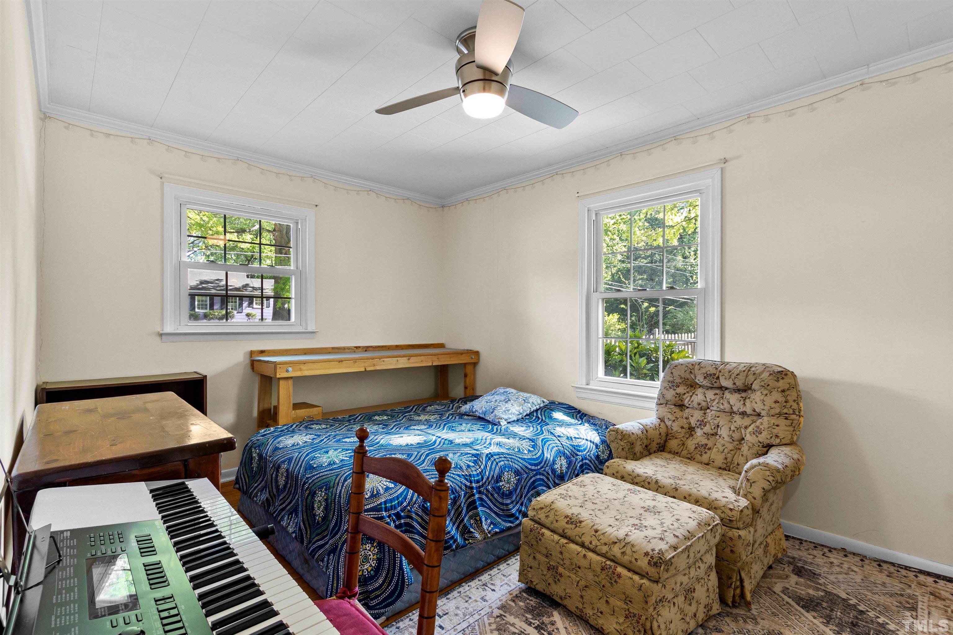 5100 Clearview Street Raleigh, NC 27603 - Photo 35 of 36 a bedroom with two beds and a window