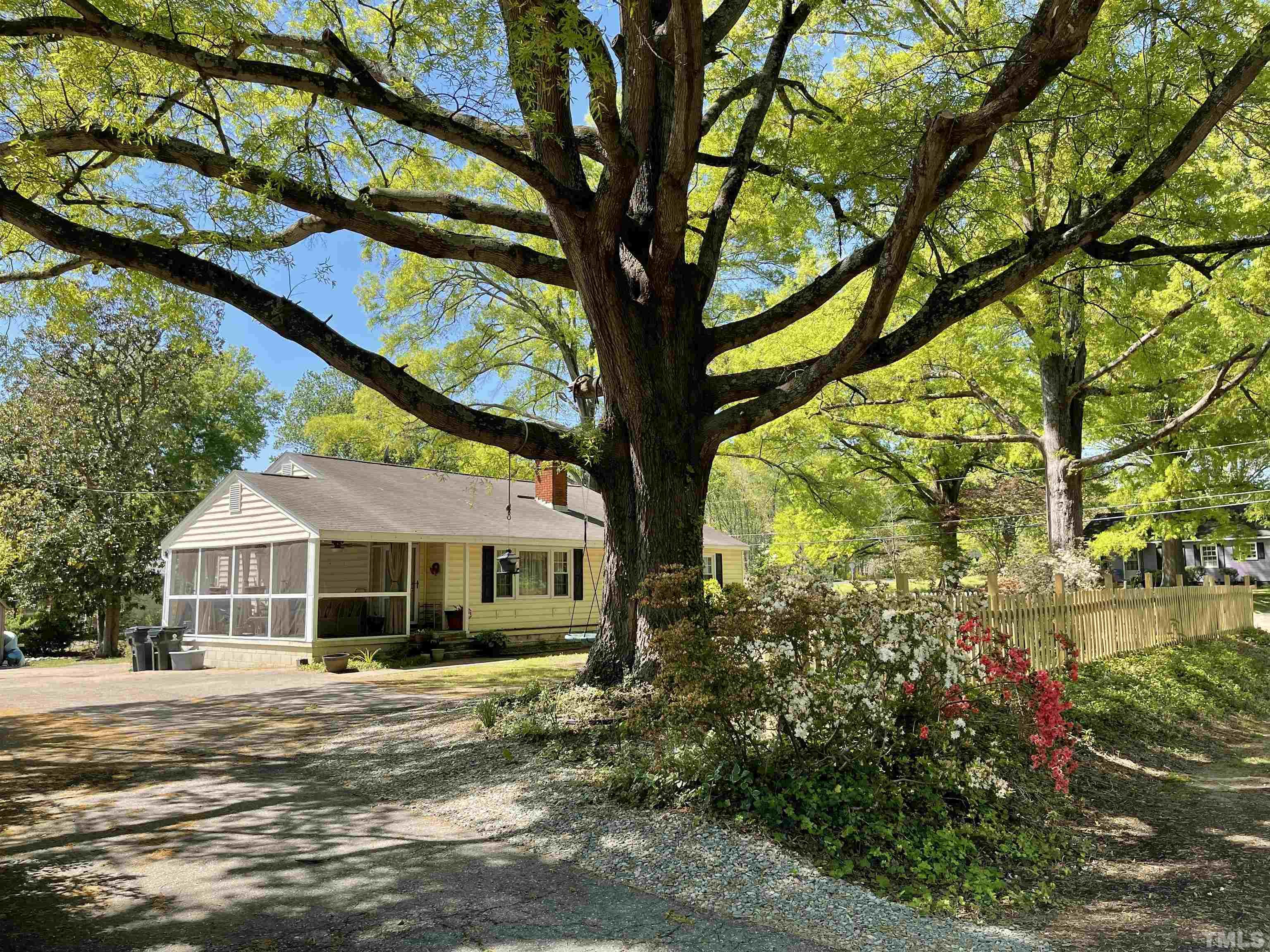 5100 Clearview Street Raleigh, NC 27603 - Photo 4 of 36 a front view of a house with garden