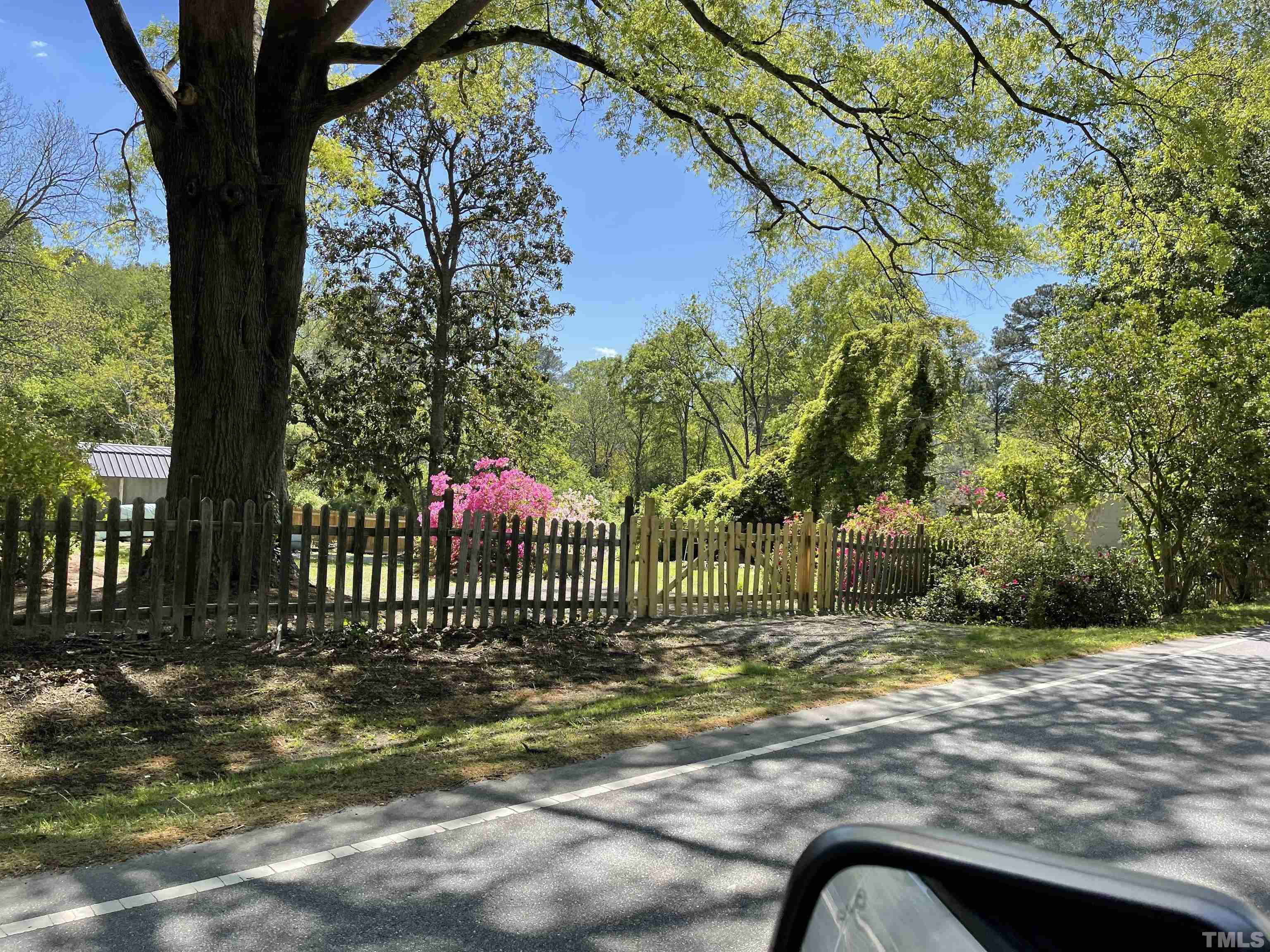 5100 Clearview Street Raleigh, NC 27603 - Photo 5 of 36 a view of a garden and a bench