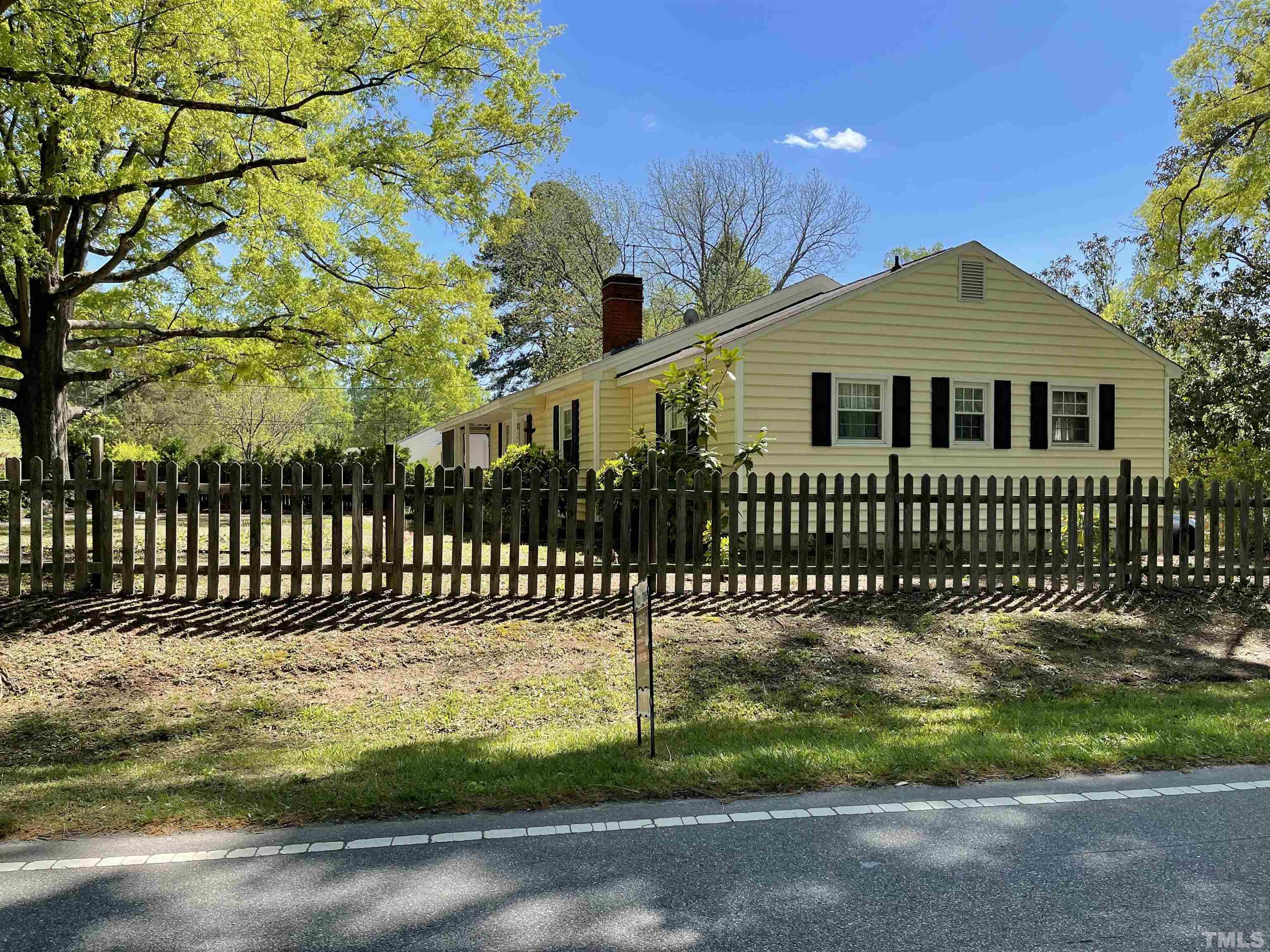 5100 Clearview Street Raleigh, NC 27603 - Photo 6 of 36 a front view of a house with a garden