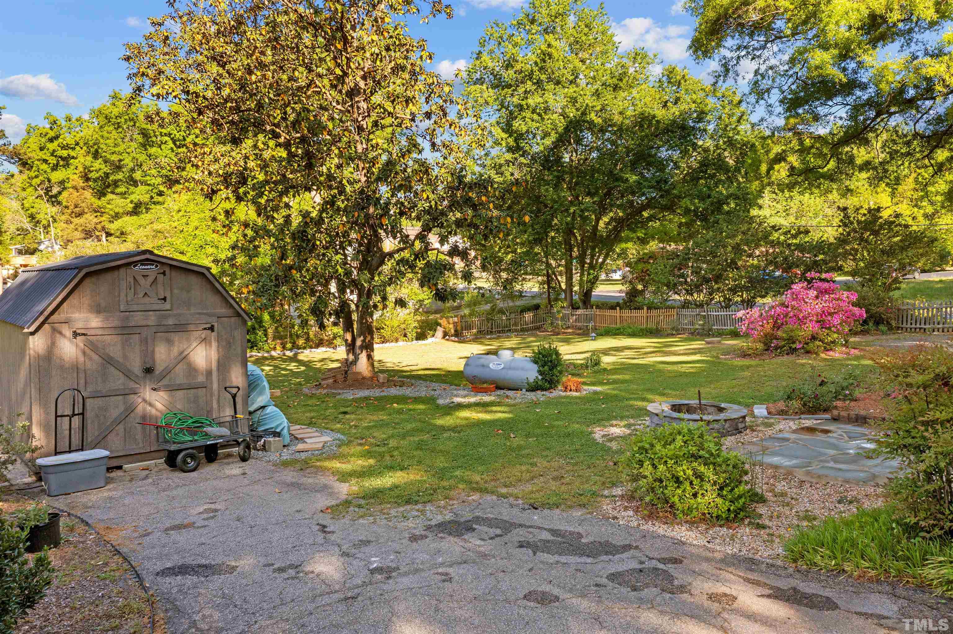 5100 Clearview Street Raleigh, NC 27603 - Photo 10 of 36 a backyard of a house with table and chairs