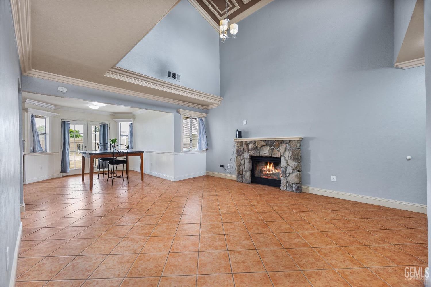 Undisclosed Address Bakersfield, CA 93307 - Photo 11 of 47 a view of an empty room with fireplace and a window