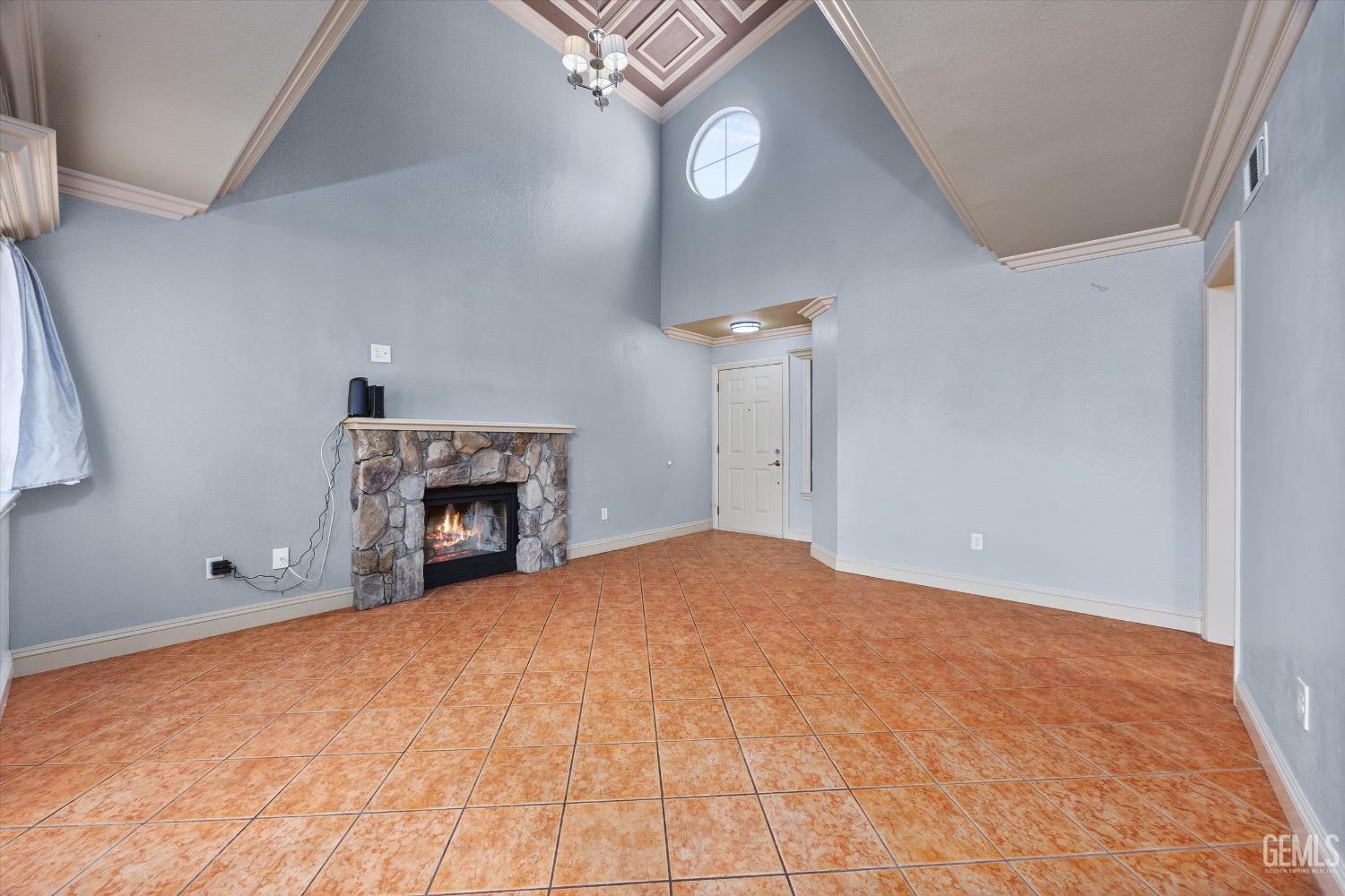 Undisclosed Address Bakersfield, CA 93307 - Photo 13 of 47 a view of an empty room with a fireplace