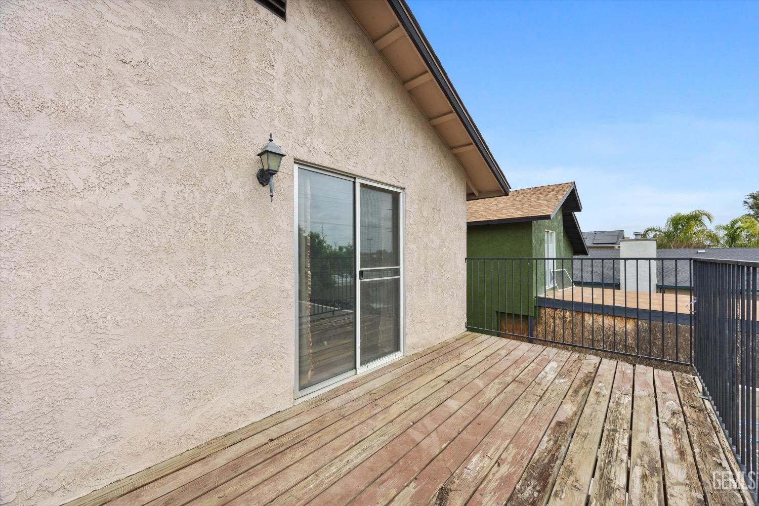 Undisclosed Address Bakersfield, CA 93307 - Photo 27 of 47 a view of backyard with wooden floor and fence