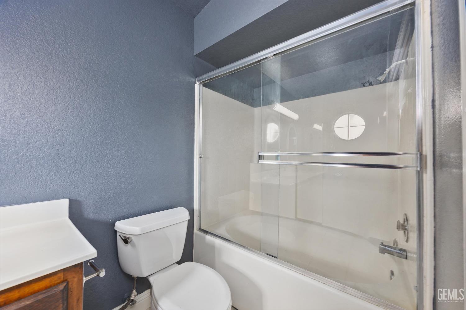 Undisclosed Address Bakersfield, CA 93307 - Photo 30 of 47 a bathroom with a toilet and a shower