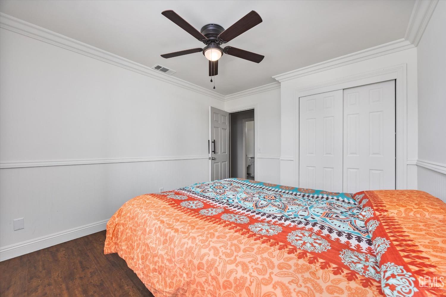 Undisclosed Address Bakersfield, CA 93307 - Photo 32 of 47 a bedroom with a bed and a large closet