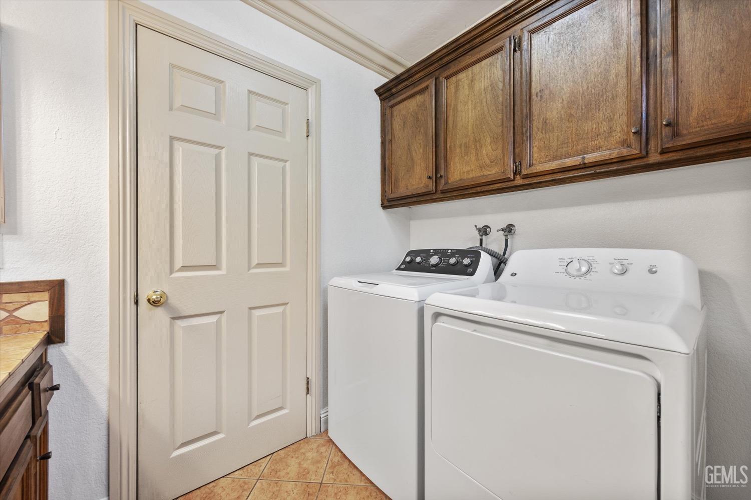 Undisclosed Address Bakersfield, CA 93307 - Photo 34 of 47 a utility room with dryer and washer