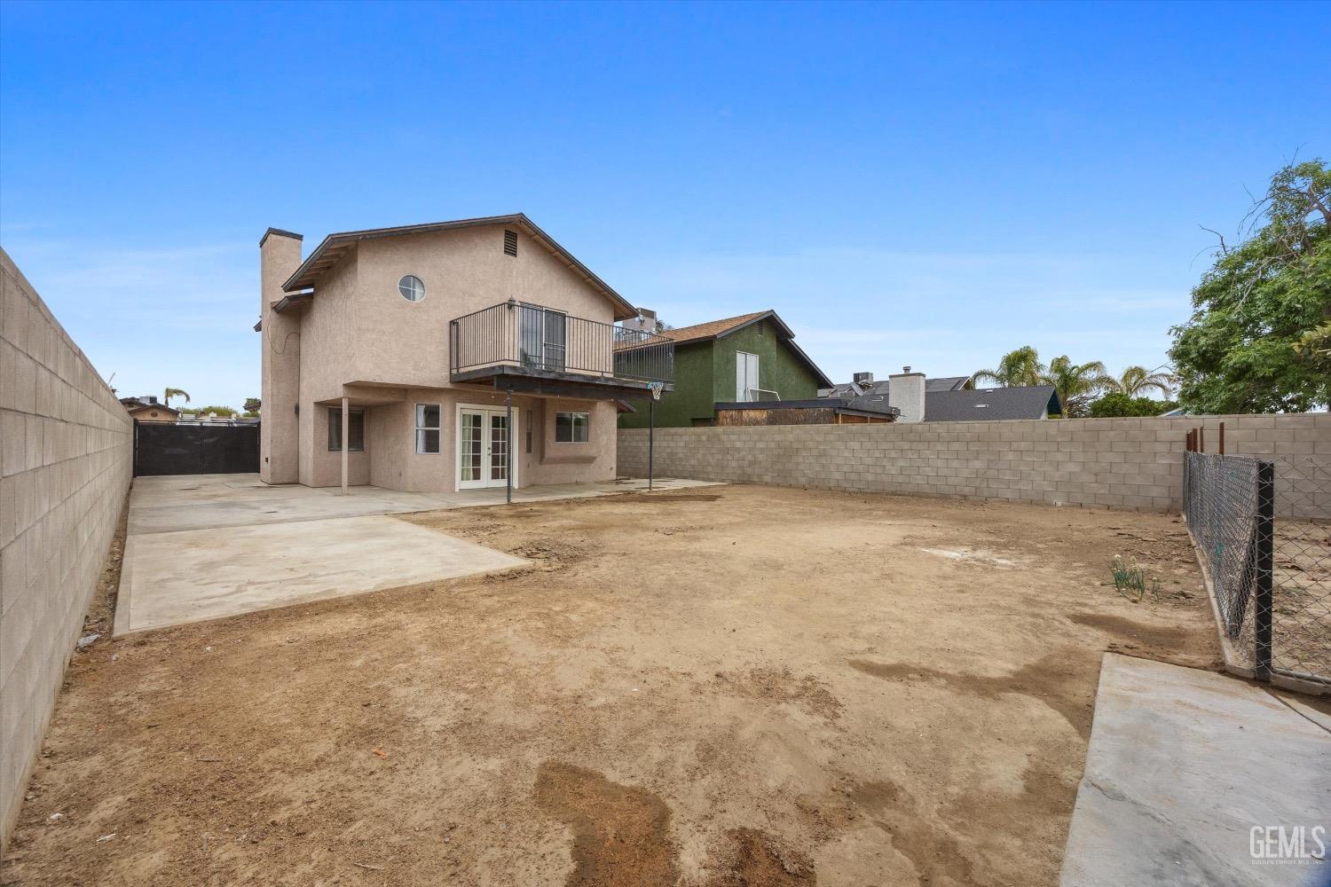 Undisclosed Address Bakersfield, CA 93307 - Photo 39 of 47 a front view of a house with a yard