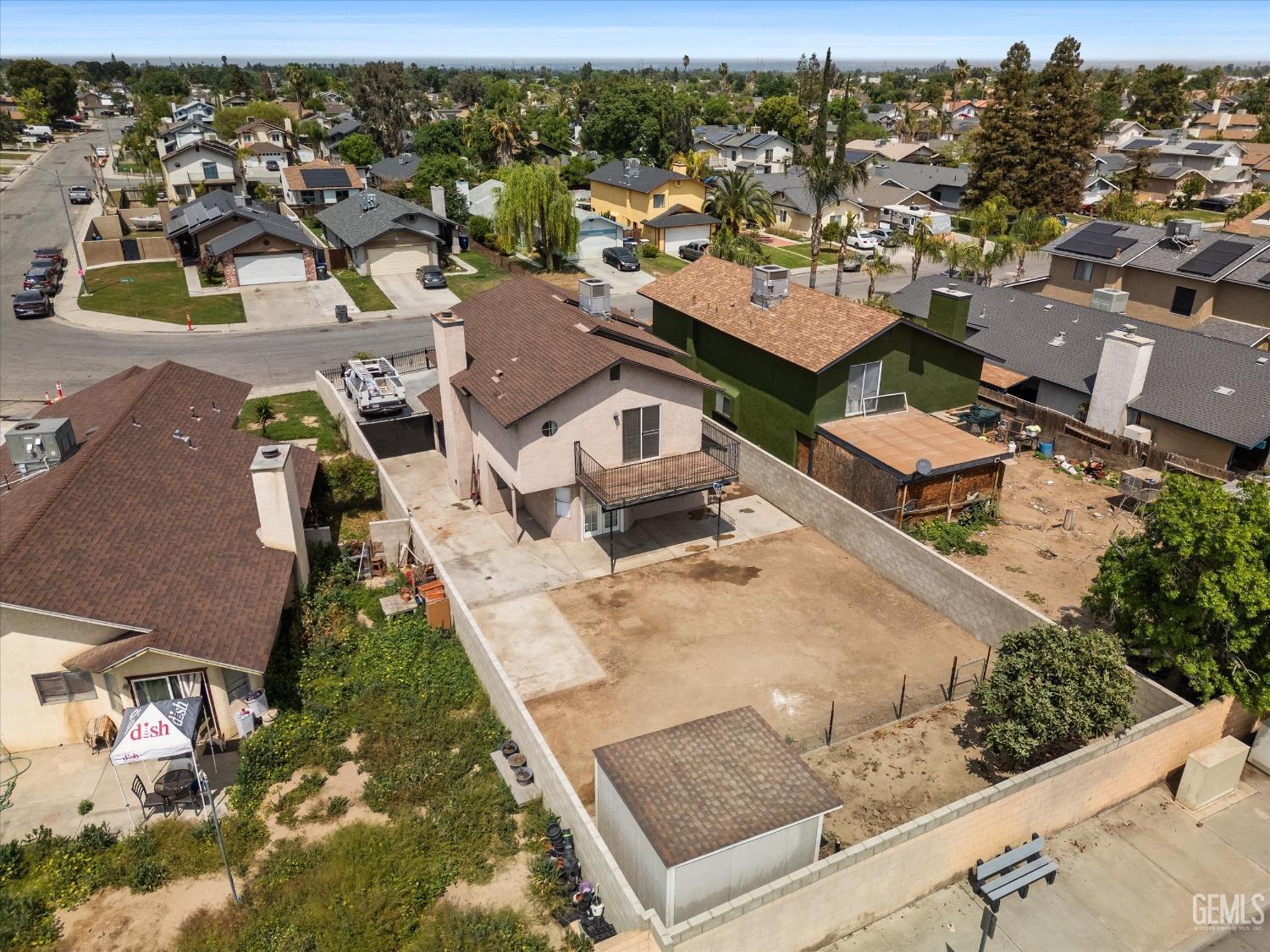 Undisclosed Address Bakersfield, CA 93307 - Photo 47 of 47 an aerial view of a house with a yard