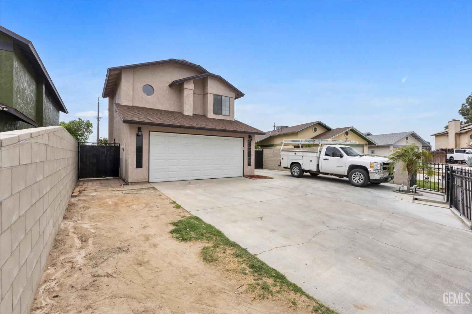 Undisclosed Address Bakersfield, CA 93307 - Photo 6 of 47 a car parked in front of a house