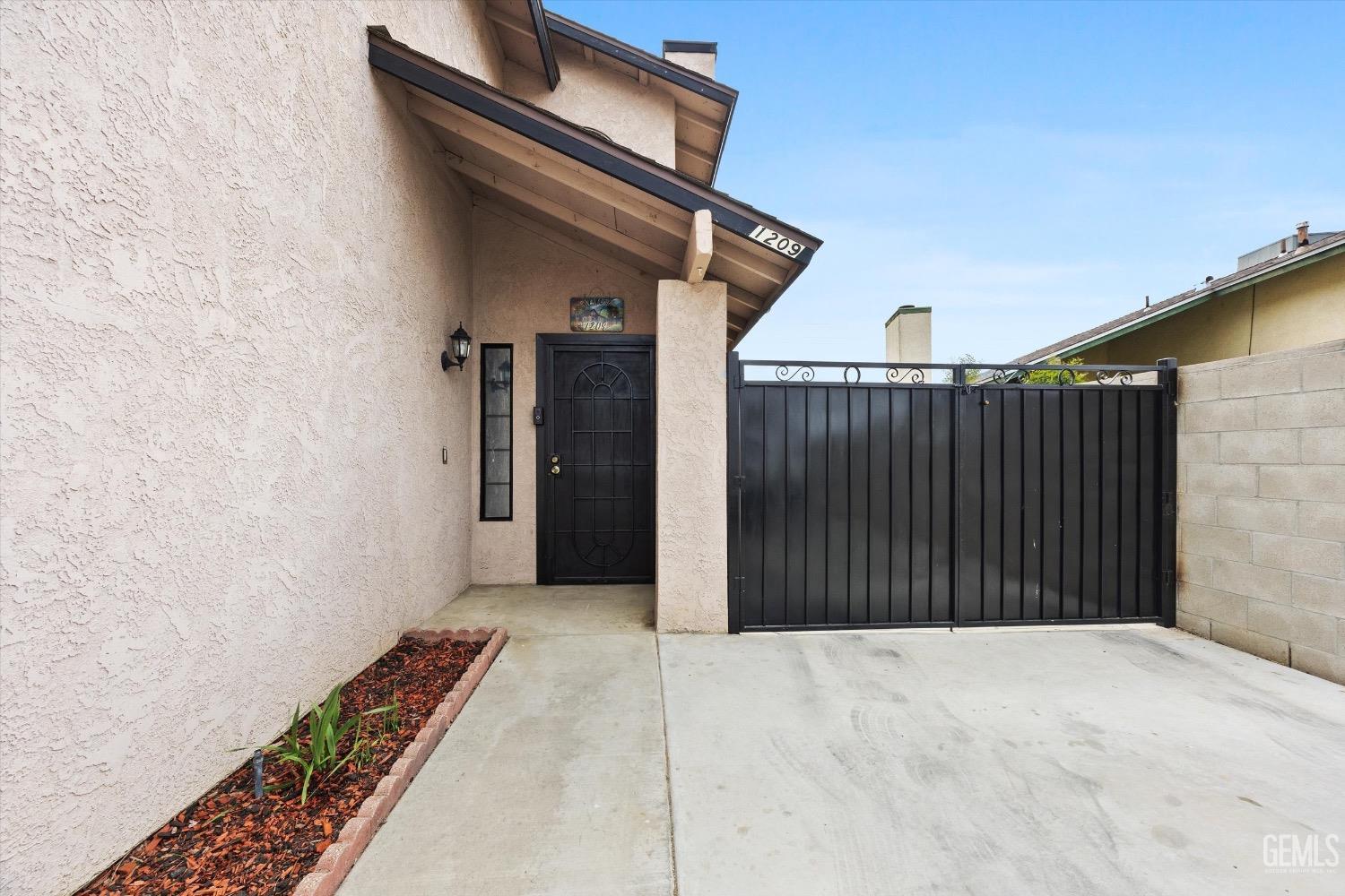 Undisclosed Address Bakersfield, CA 93307 - Photo 8 of 47 a view of a wooden door
