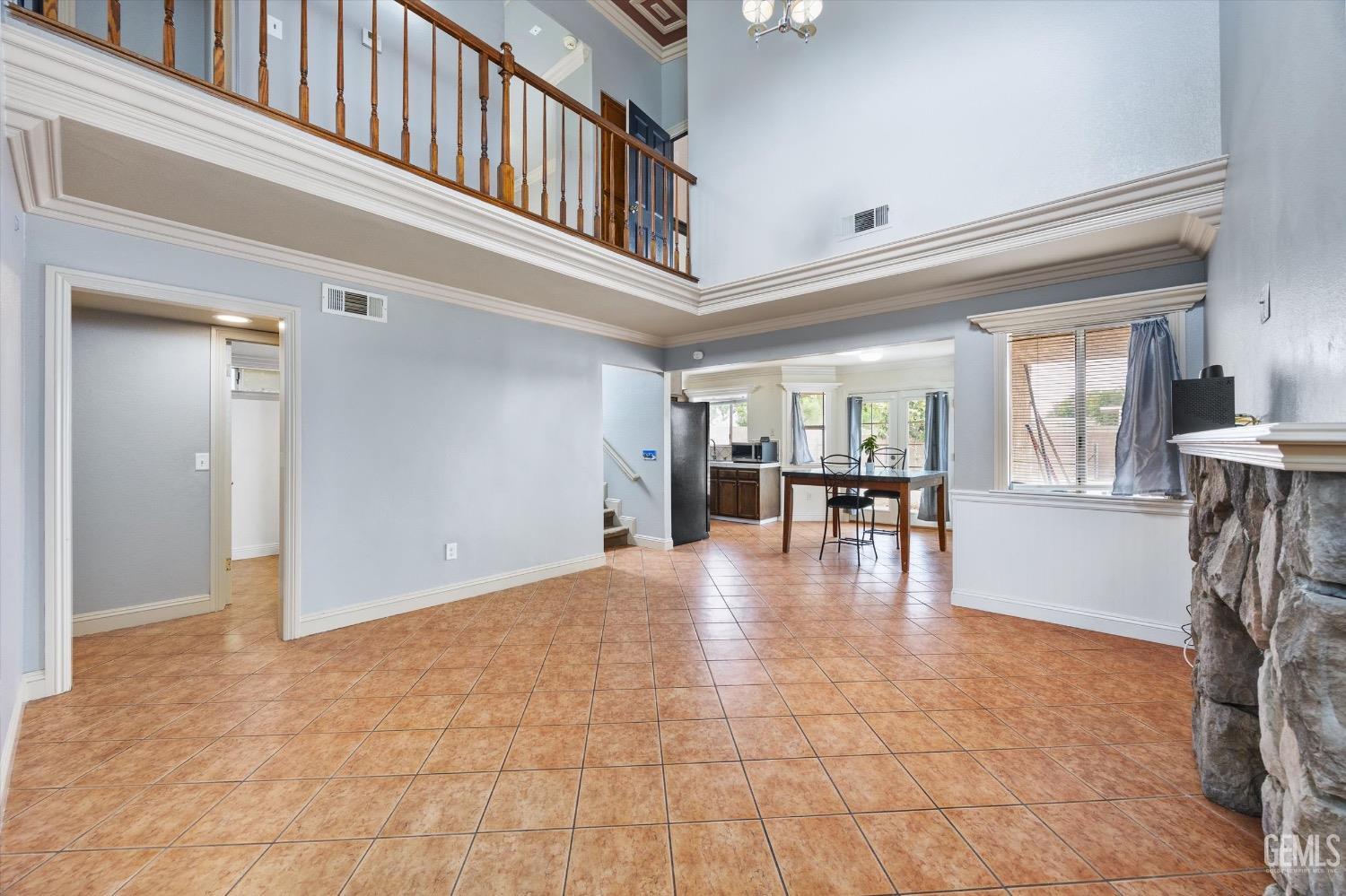 Undisclosed Address Bakersfield, CA 93307 - Photo 9 of 47 a view of livingroom with kitchen and dinning room