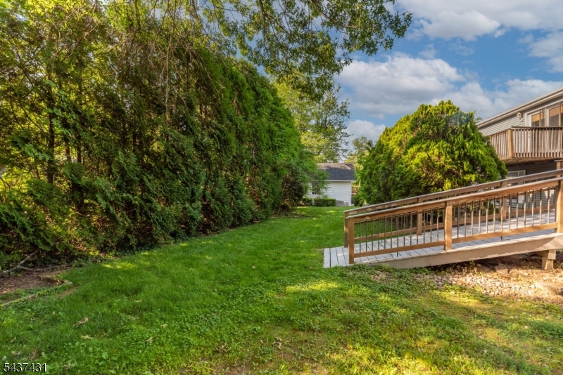 20 Wanaque Road West Milford, NJ 07421 - Photo 21 of 31 a view of a house with a small yard and sitting area
