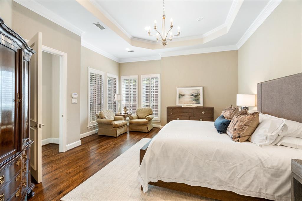 5116 Meadowside Lane Plano, TX 75093 - Photo 15 of 36 a bedroom with a balcony a bed and a couch