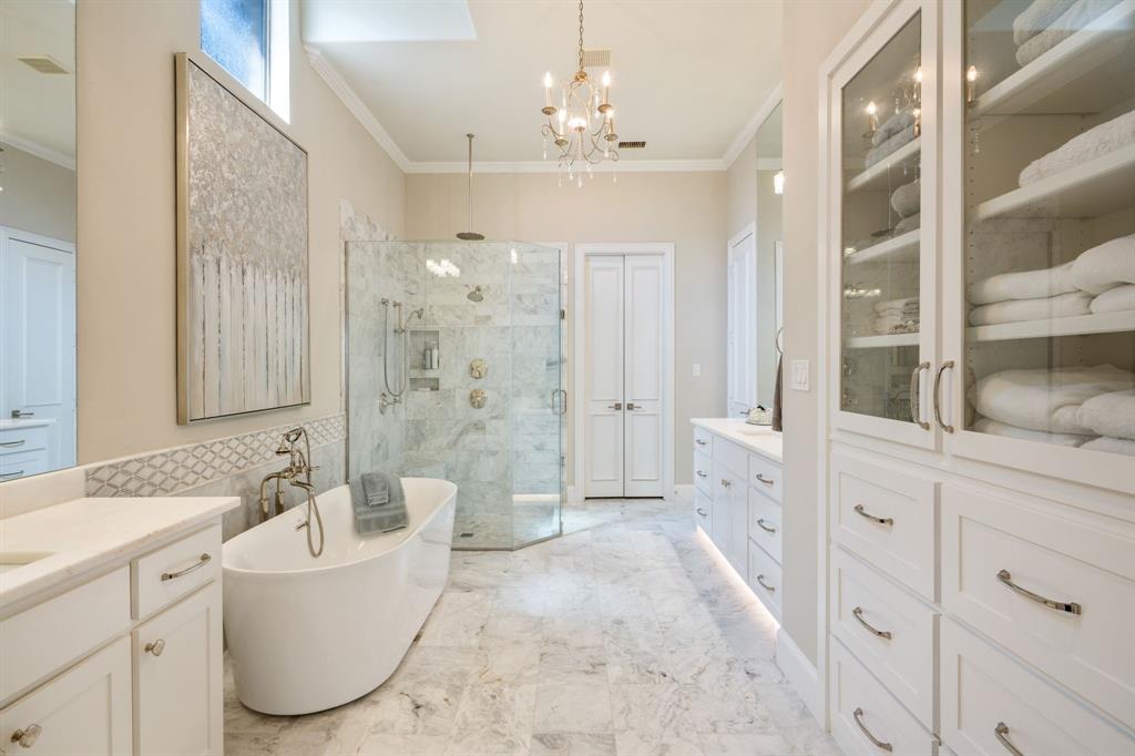 5116 Meadowside Lane Plano, TX 75093 - Photo 17 of 36 a spacious bathroom with a tub sink and mirror