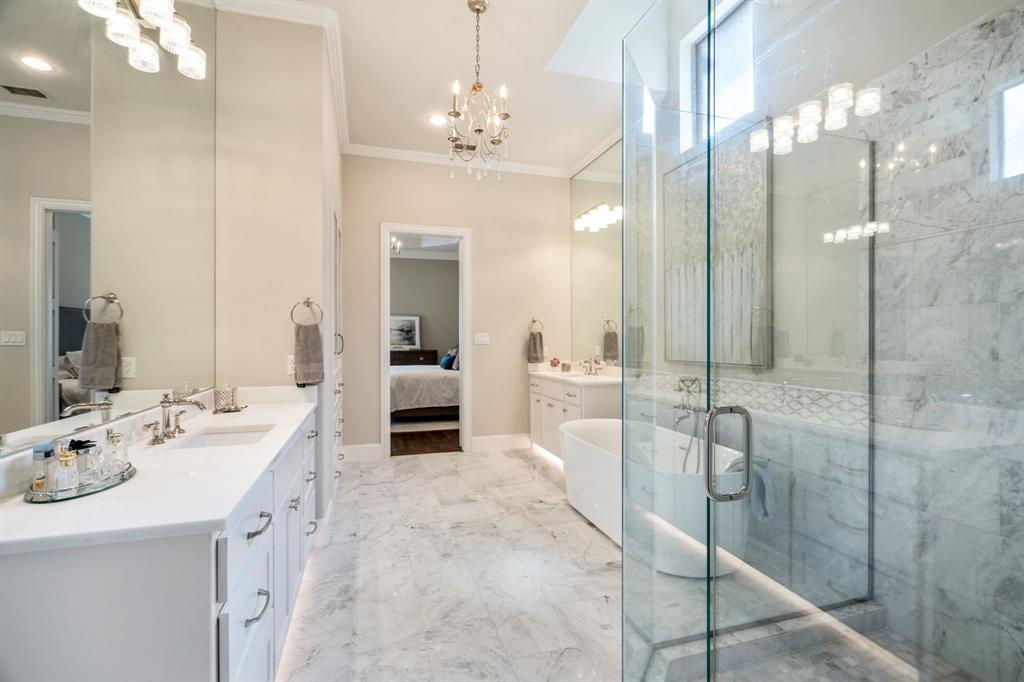 5116 Meadowside Lane Plano, TX 75093 - Photo 19 of 36 a spacious bathroom with a double vanity sink mirror and shower