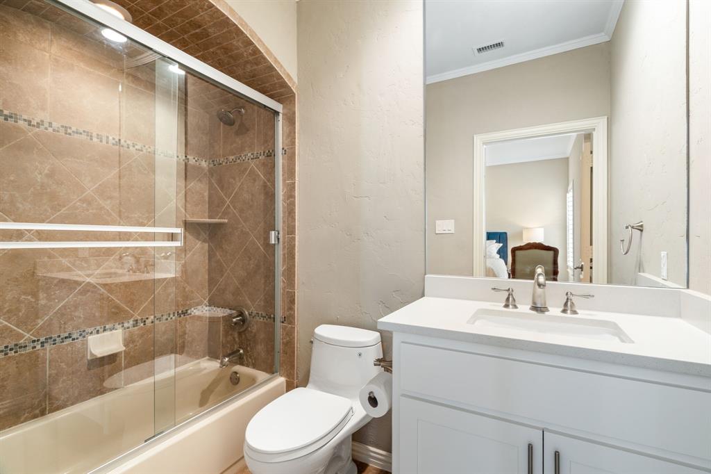 5116 Meadowside Lane Plano, TX 75093 - Photo 21 of 36 a bathroom with a sink toilet and shower