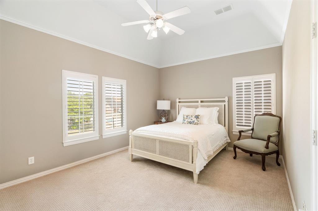 5116 Meadowside Lane Plano, TX 75093 - Photo 22 of 36 a bedroom with a bed and a window