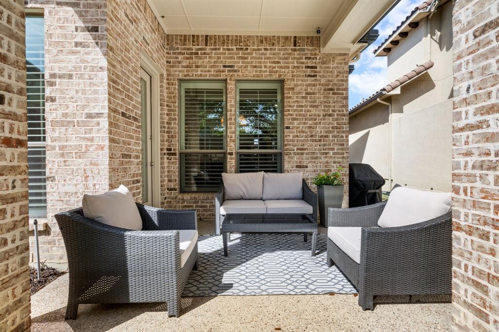 5116 Meadowside Lane Plano, TX 75093 - Photo 26 of 36 a view of a patio with couches and a potted plant