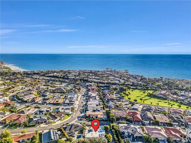 an aerial view of residential building and ocean