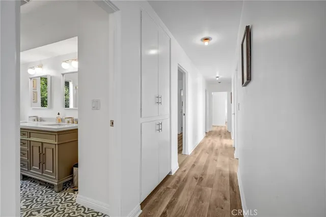 a view of a bathroom with a sink and mirror