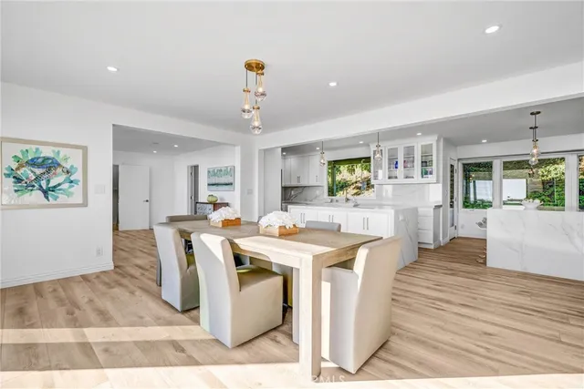 a view of a dining hall with furniture and wooden floor
