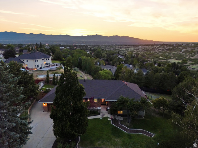2342 Charros Road Sandy, UT 84092 - Photo 5 of 94 Expansive property with a dark shingle roof and a paved driveway