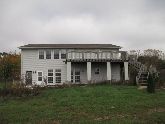 1953 Twist Road Franklin Grove, IL 61031 - Photo 15 of 16 a house view with a garden space