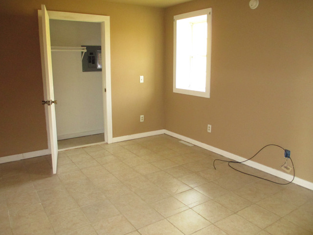 1953 Twist Road Franklin Grove, IL 61031 - Photo 7 of 16 an empty room with a window
