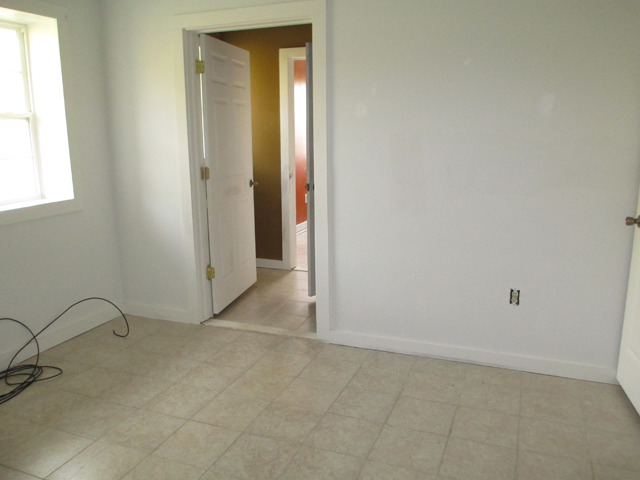 1953 Twist Road Franklin Grove, IL 61031 - Photo 8 of 16 an empty room with a window